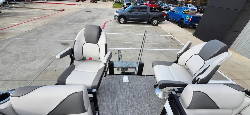 Slide: The Image of 2023 Avalon VEN 2180 FNC boat seats in a parking lot setting. - 28