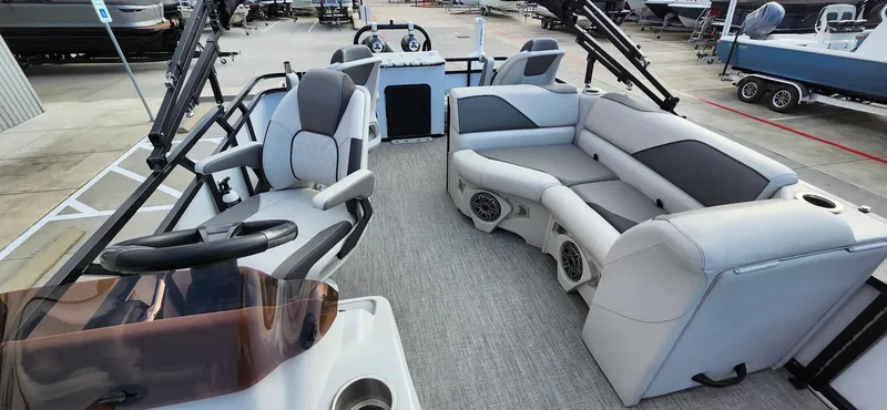 Slide: The Image of 2023 Avalon VEN 2180 FNC boat interior with modern seating and steering wheel. - 30