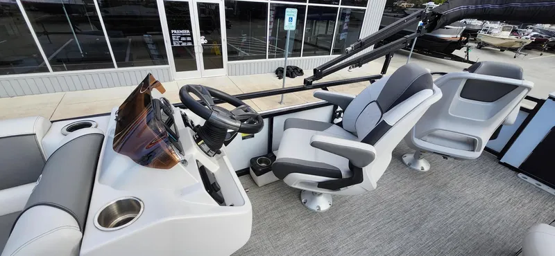 Slide: The Image of 2023 Avalon VEN 2180 FNC boat interior with modern helm and comfortable seating. - 31