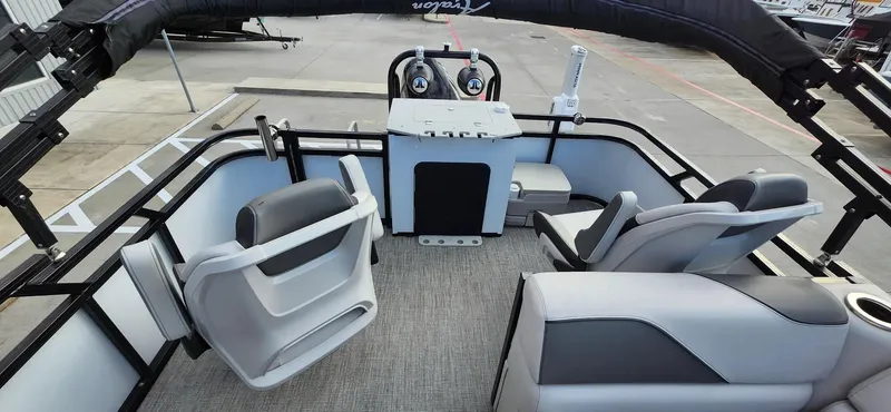 Slide: The Image of 2023 Avalon VEN 2180 FNC boat interior with modern seating and control panel. - 35