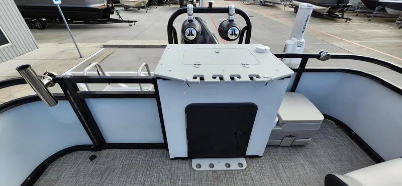 Slide: The Image of 2023 Avalon VEN 2180 FNC boat deck with storage and seating area. - 37