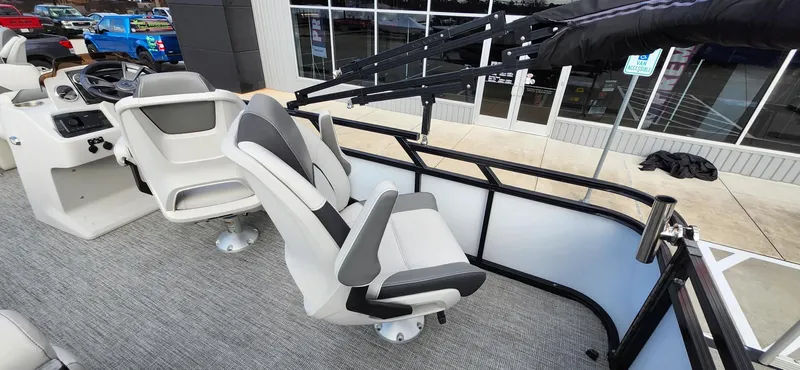Slide: The Image of 2023 Avalon VEN 2180 FNC boat interior with modern seating and steering console. - 38