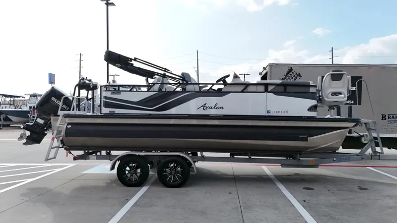 Slide: The Image of 2023 Avalon VEN 2180 FNC pontoon boat on trailer in parking lot. - 5