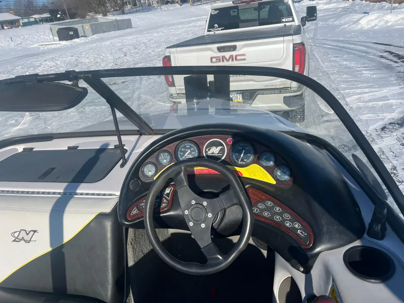 Slide: The Image of 2000 Correct Craft Ski Nautique dashboard with GMC truck in snowy background. - 3
