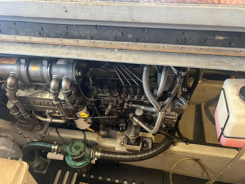 Slide: The Image of Engine compartment of a 2004 Mainship 40 FT Sedan Bridge boat. - 35