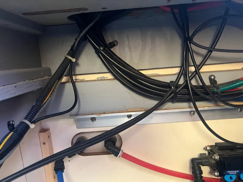 Slide: The Image of Wiring and cables inside a 2004 Mainship 40 FT Sedan Bridge boat. - 38