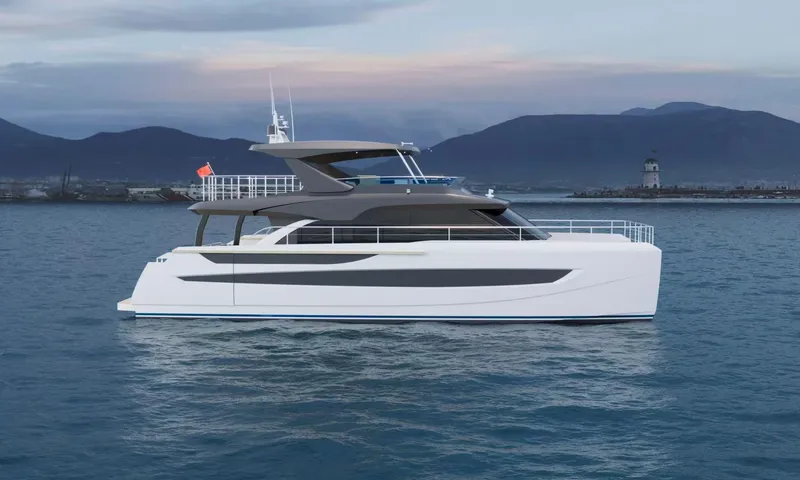 Slide: The Image of 2025 Catamaran Diamond Yachts EF63 on calm water with mountainous backdrop. - 1