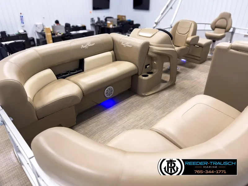 Slide: The Image of 2023 SunChaser 20 Vista Fish boat interior with beige seating and blue accent lighting. - 10