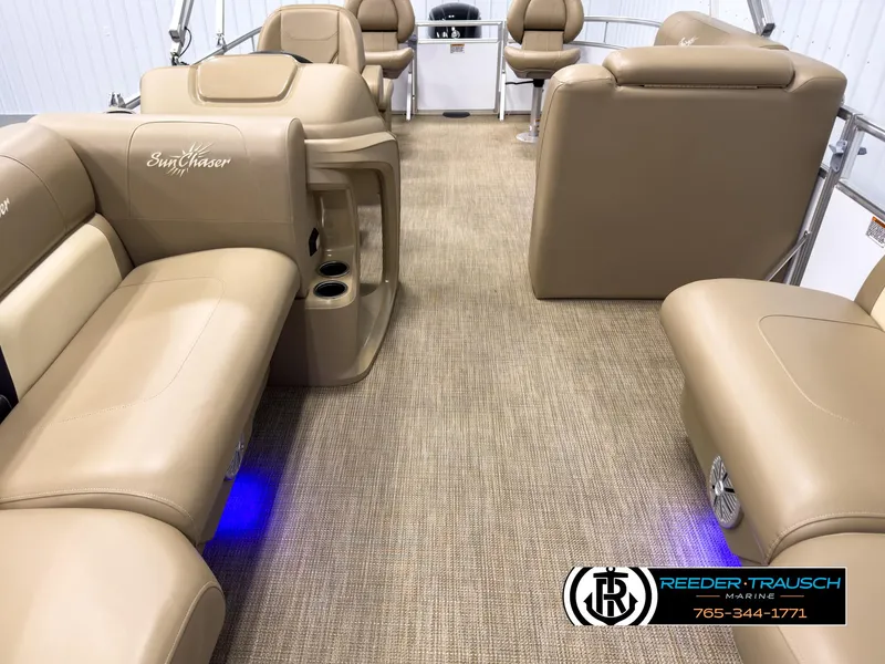 Slide: The Image of Interior of 2023 SunChaser 20 Vista Fish pontoon boat with beige seating and blue lighting. - 13