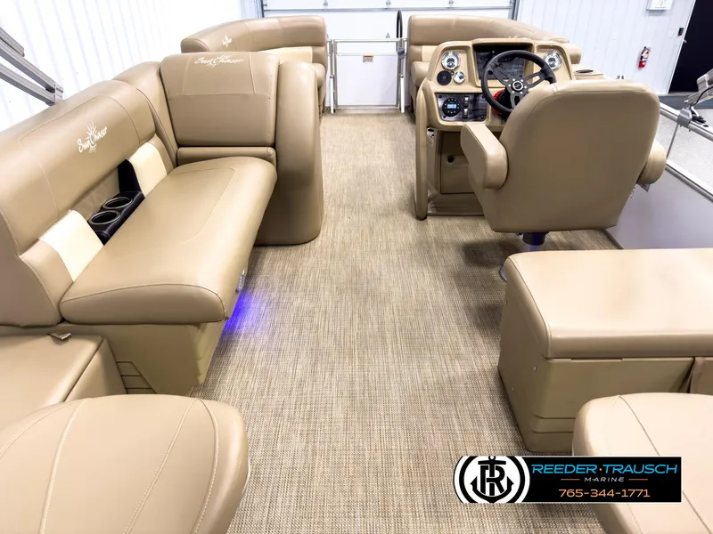 Slide: The Image of 2023 SunChaser 20 Vista Fish boat interior with tan seating and modern dashboard. - 16