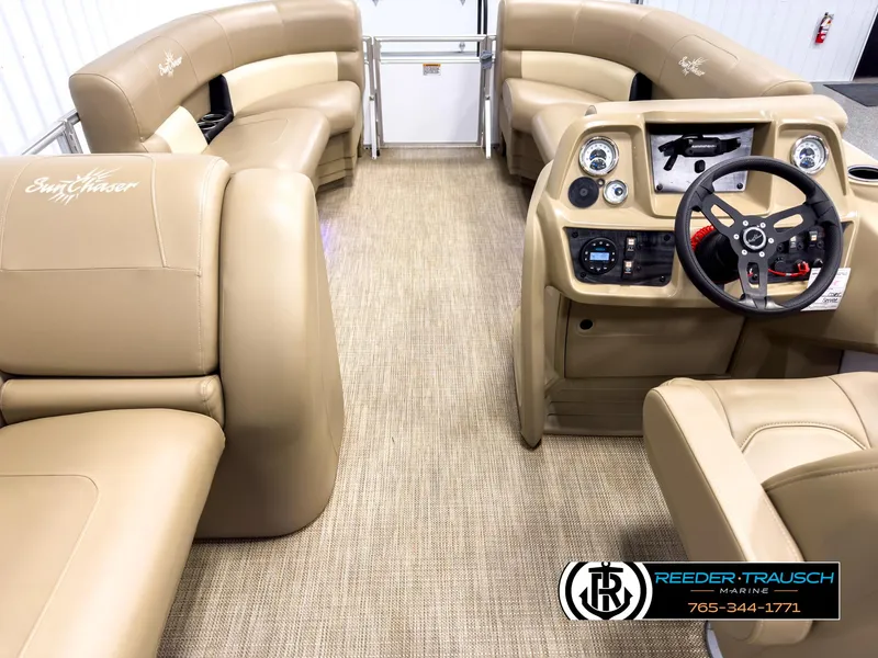 Slide: The Image of 2023 SunChaser 20 Vista Fish interior with beige seating and modern dashboard. - 17