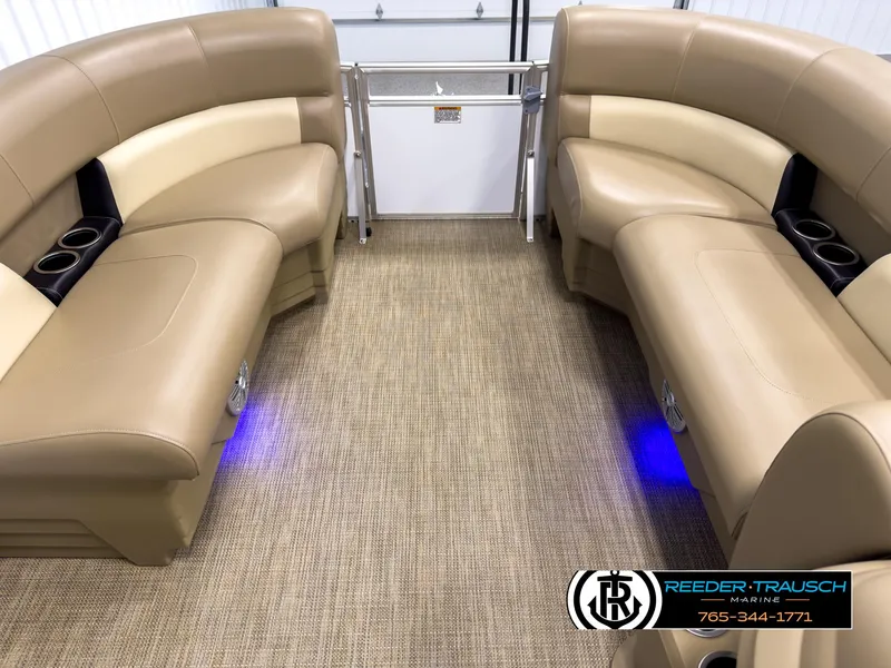 Slide: The Image of 2023 SunChaser 20 Vista Fish interior with tan seating and blue LED lighting. - 18