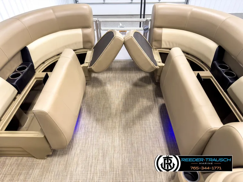 Slide: The Image of 2023 SunChaser 20 Vista Fish boat interior with tan seating and cup holders. - 19