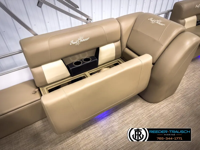 Slide: The Image of 2023 SunChaser 20 Vista Fish boat seating with cup holders, beige upholstery, Reeder-Trausch Marine logo. - 21