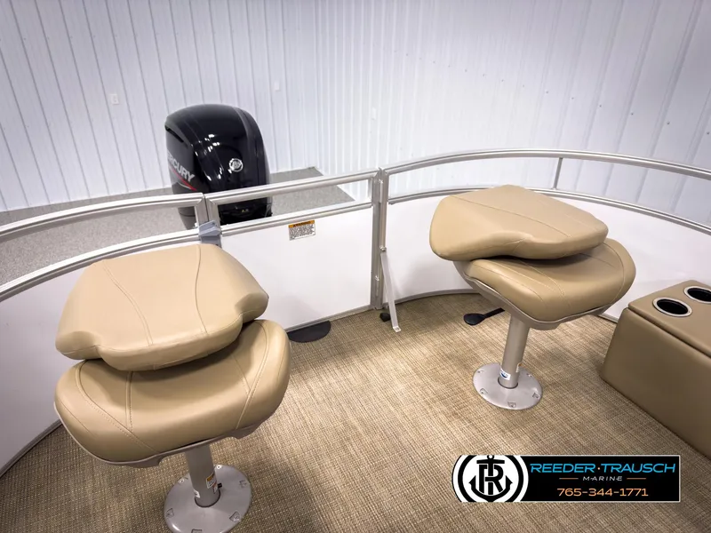 Slide: The Image of 2023 SunChaser 20 Vista Fish boat interior with beige seats and motor. - 25