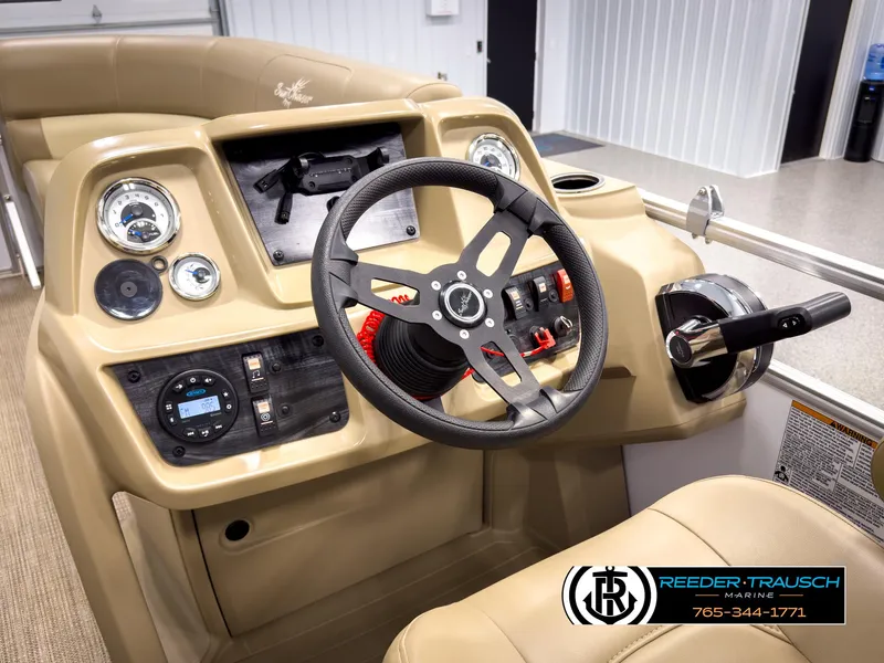Slide: The Image of 2023 SunChaser 20 Vista Fish boat dashboard with steering wheel and controls. - 27