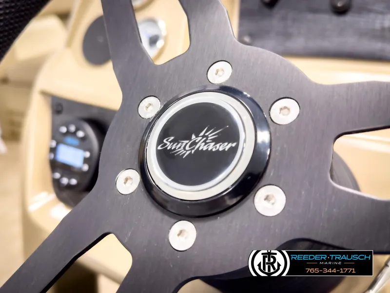 Slide: The Image of Steering wheel of 2023 SunChaser 20 Vista Fish boat, featuring brand logo. - 28