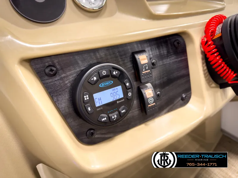 Slide: The Image of 2023 SunChaser 20 Vista Fish dashboard with radio controls and safety features. - 29