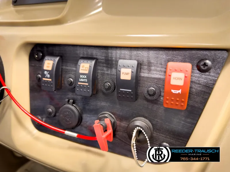 Slide: The Image of Control panel of 2023 SunChaser 20 Vista Fish boat with switches and key. - 32