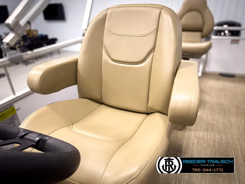 Slide: The Image of 2023 SunChaser 20 Vista Fish boat seat with beige upholstery and armrests. - 33