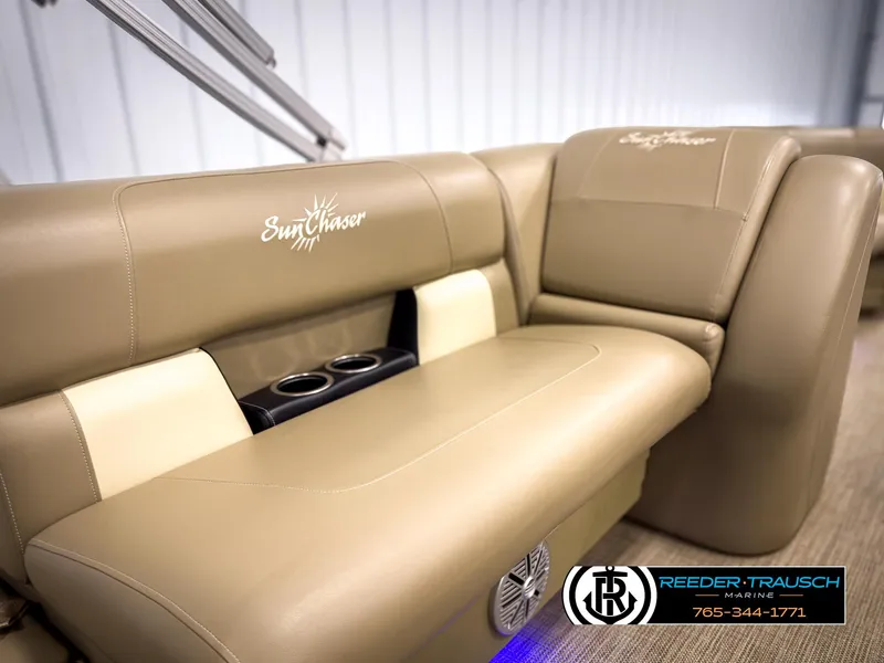 Slide: The Image of 2023 SunChaser 20 Vista Fish boat interior with tan seating and cup holders. - 34