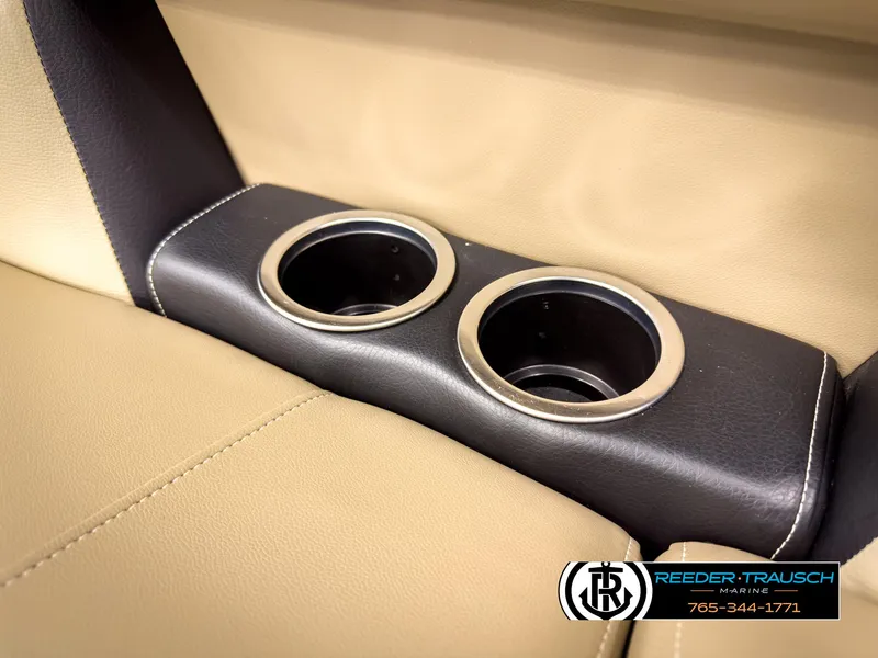 Slide: The Image of Cup holders in 2023 SunChaser 20 Vista Fish boat interior, beige and black design. - 36