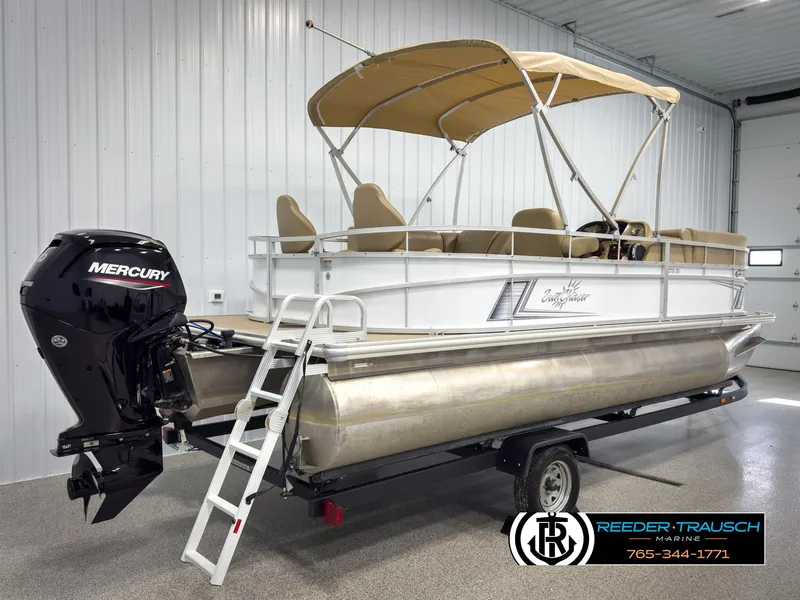 Slide: The Image of 2023 SunChaser 20 Vista Fish pontoon boat with Mercury engine in a showroom. - 6