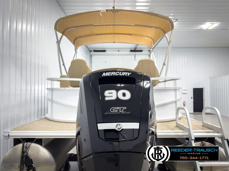 Slide: The Image of 2023 SunChaser 20 Vista Fish pontoon boat with Mercury 90 GT engine in storage. - 7