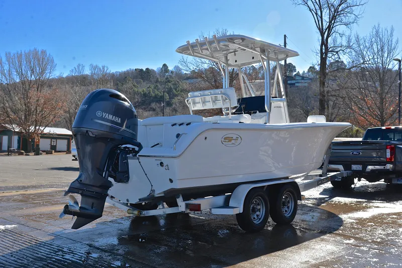 Slide: The Image of 2019 Sea Hunt 225 Ultra boat on trailer with Yamaha outboard motor. - 14