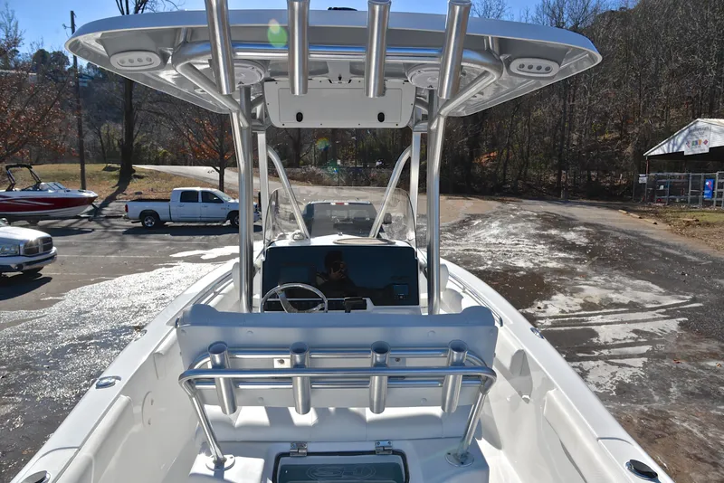 Slide: The Image of 2019 Sea Hunt 225 Ultra boat with T-top, parked on a sunny day. - 18