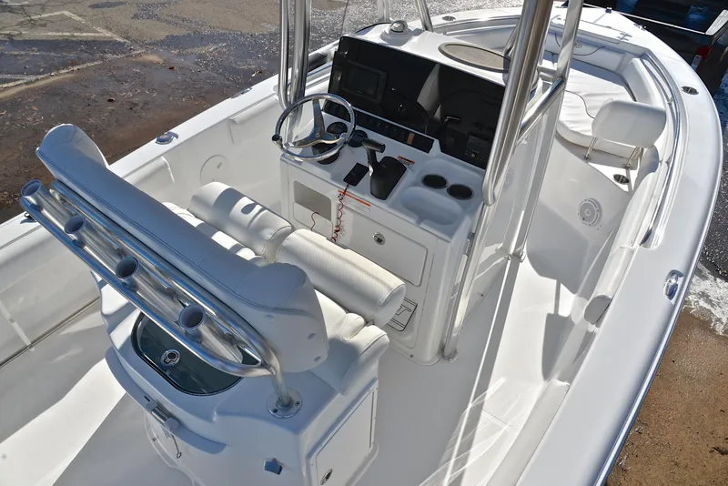 Slide: The Image of 2019 Sea Hunt 225 Ultra boat interior with steering console and seating. - 19