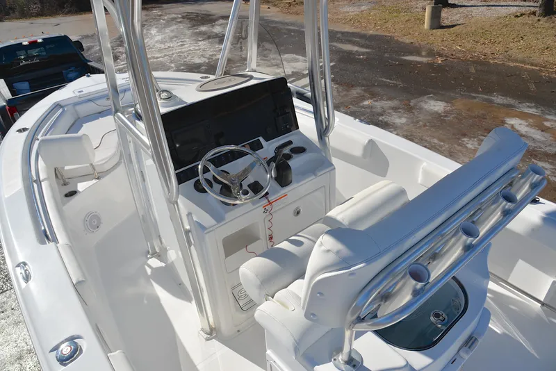 Slide: The Image of 2019 Sea Hunt 225 Ultra boat interior with steering console and seating. - 20