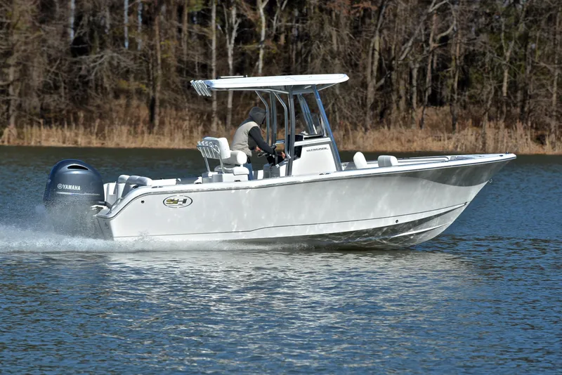 Slide: The Image of 2019 Sea Hunt 225 Ultra boat cruising on a calm lake. - 3