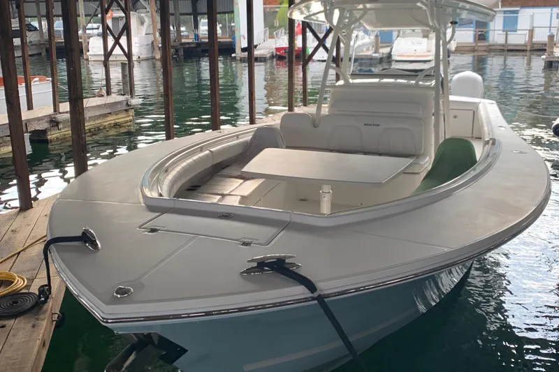 Slide: The Image of 2007 Regulator 34 Center Console boat docked in marina. - 21