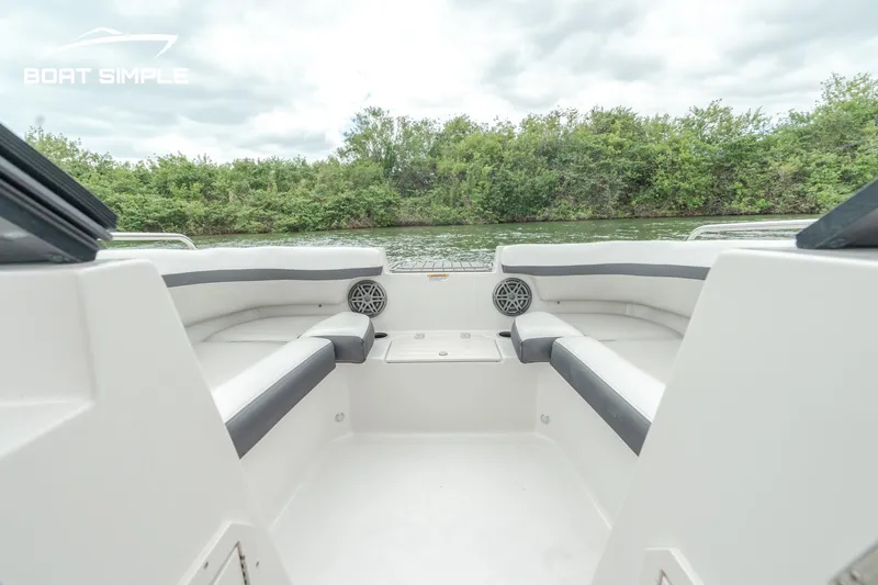 Slide: The Image of 2024 Starcraft SVX 190 OB DC boat interior with seating and water view. - 9