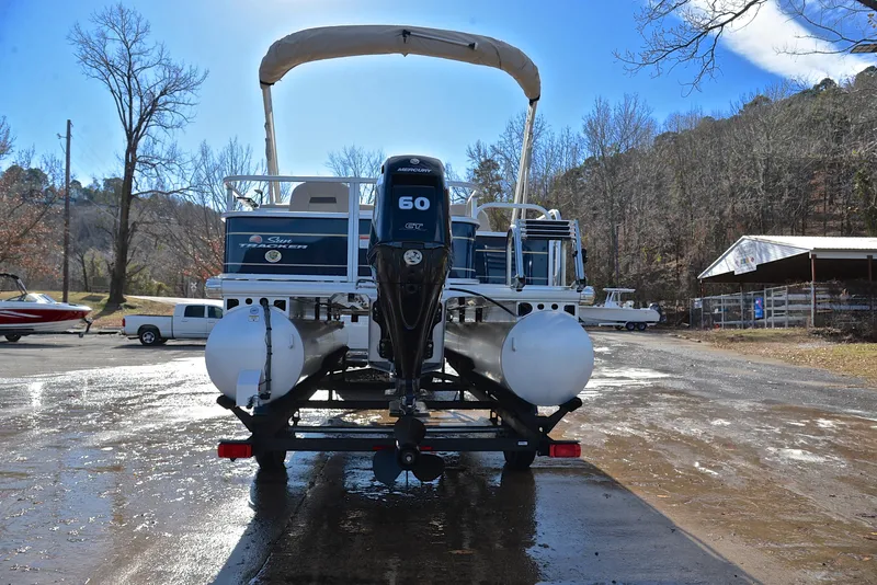 Slide: The Image of 2023 Sun Tracker Bass Buggy 18 DLX pontoon boat on trailer, rear view. - 13