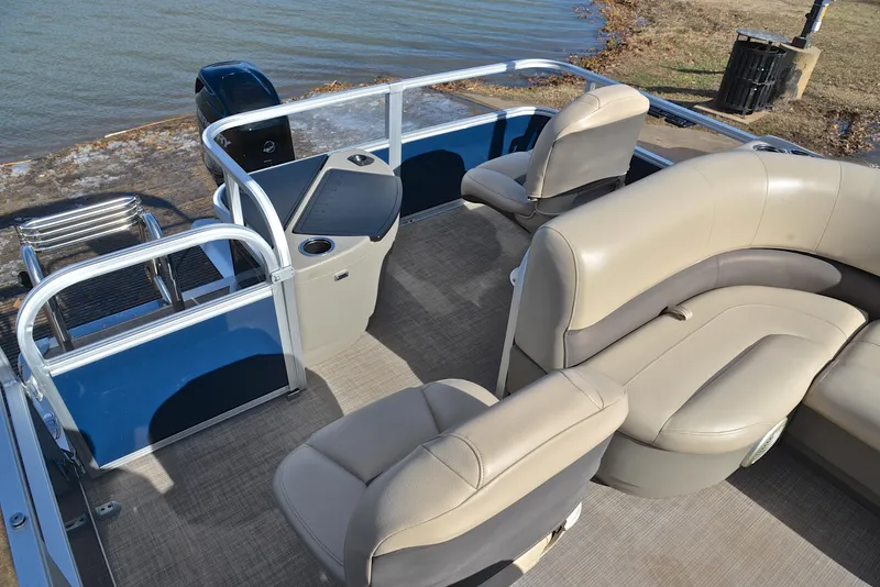 Slide: The Image of 2023 Sun Tracker Bass Buggy 18 DLX pontoon boat interior with beige seating. - 24
