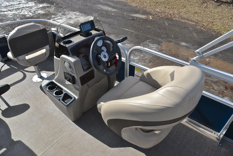 Slide: The Image of 2023 Sun Tracker Bass Buggy 18 DLX boat interior with steering console and seating. - 26