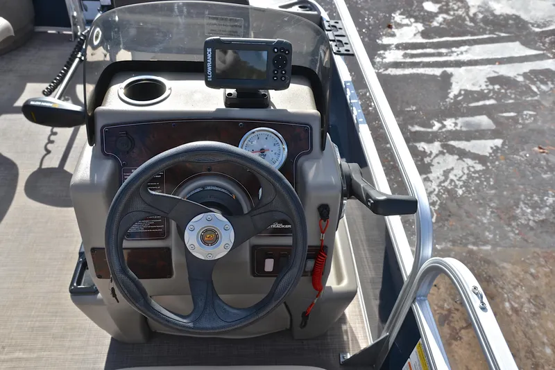 Slide: The Image of 2023 Sun Tracker Bass Buggy 18 DLX steering console with navigation equipment. - 27