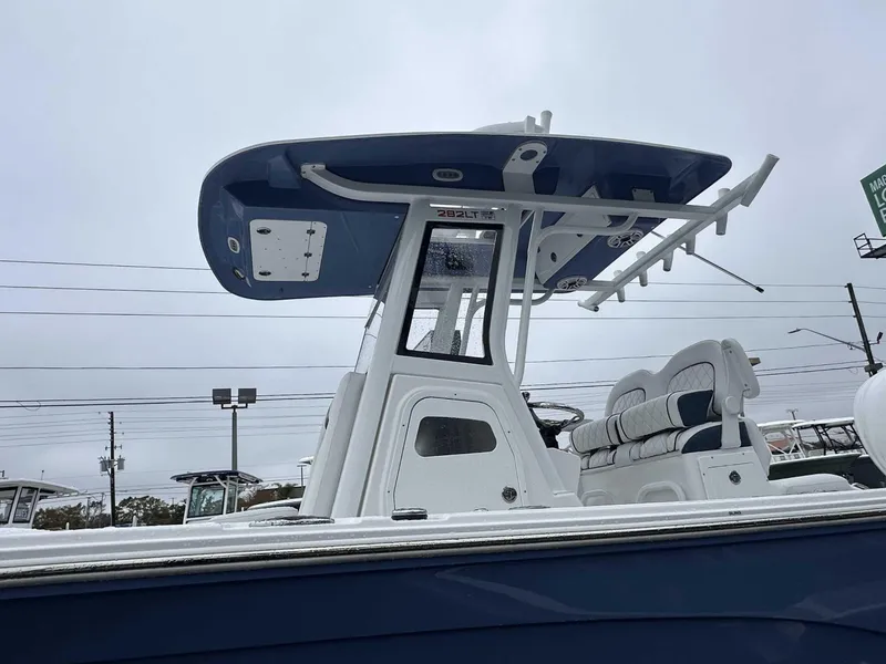 Slide: The Image of 2025 Sea Fox 282 Hybrid LT boat with T-top and seating, viewed from the side. - 1