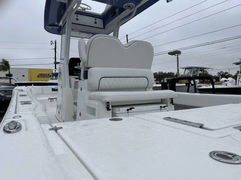 Slide: The Image of 2025 Sea Fox 282 Hybrid LT boat interior with white seating and console. - 10