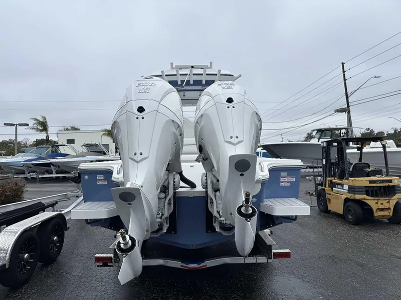 Slide: The Image of 2025 Sea Fox 282 Hybrid LT with dual outboard engines on a trailer. - 12