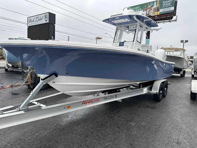 Slide: The Image of 2025 Sea Fox 282 Hybrid LT boat on trailer, displayed outdoors. - 3