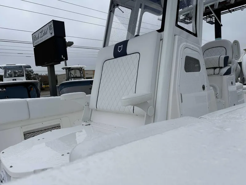 Slide: The Image of 2025 Sea Fox 282 Hybrid LT boat interior with white seating and console. - 4