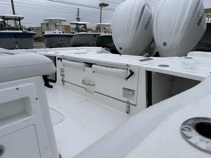 Slide: The Image of 2025 Sea Fox 282 Hybrid LT boat with dual Yamaha engines, wet deck view. - 6