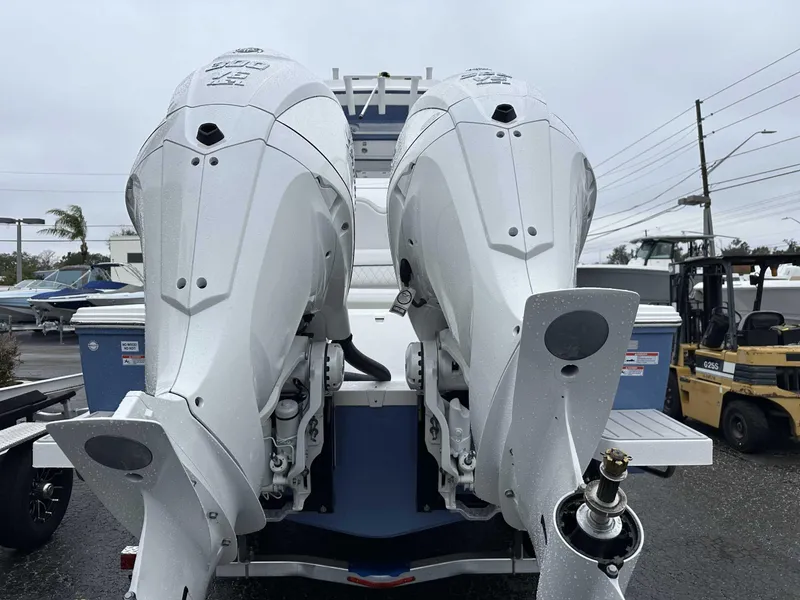 Slide: The Image of 2025 Sea Fox 282 Hybrid LT with dual outboard engines, rear view. - 9
