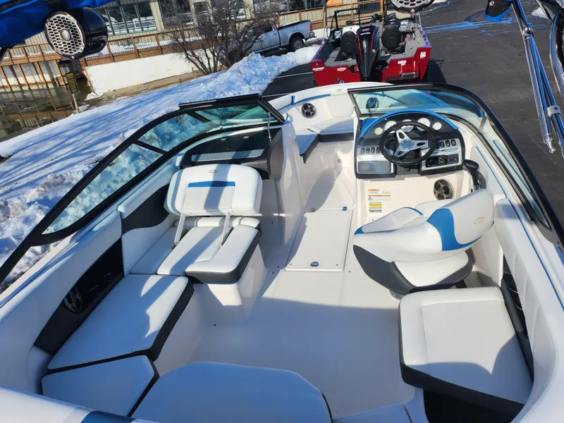 Slide: The Image of 2016 Regal 2000 ESX Bowrider interior with white seating and modern dashboard. - 10