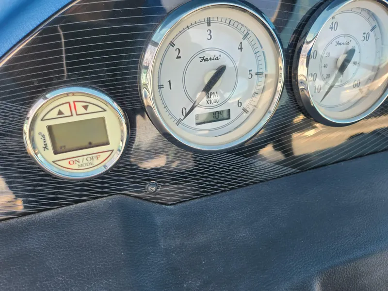 Slide: The Image of Dashboard of a 2016 Regal 2000 ESX Bowrider with gauges and digital display. - 13