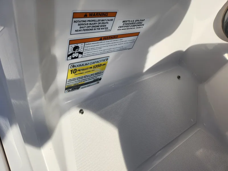 Slide: The Image of 2016 Regal 2000 ESX Bowrider warning labels and capacity information on interior surface. - 15
