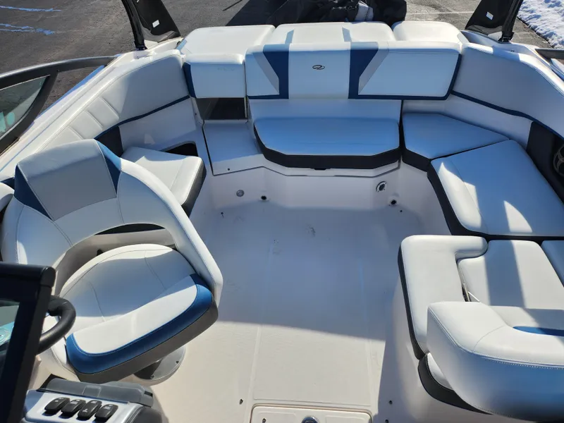 Slide: The Image of 2016 Regal 2000 ESX Bowrider interior with white and blue seating arrangement. - 19